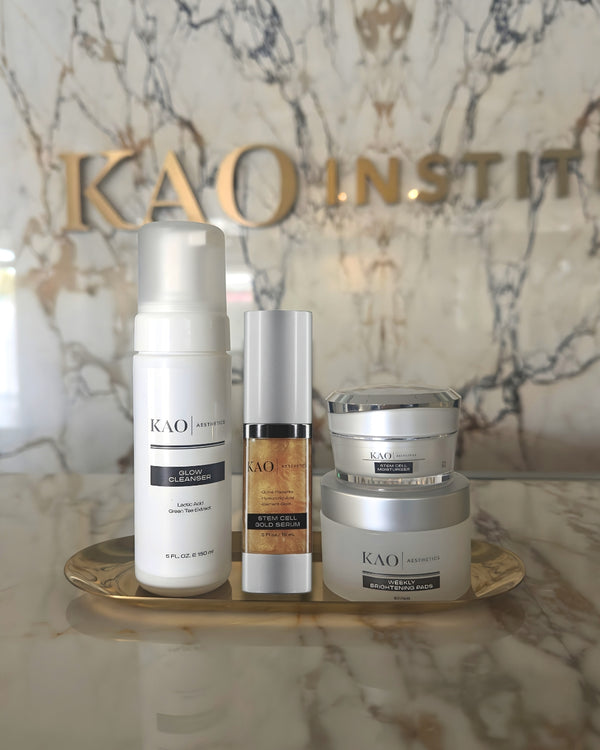 KAO Institute skincare products on a marble surface with 'KAO' branding.
